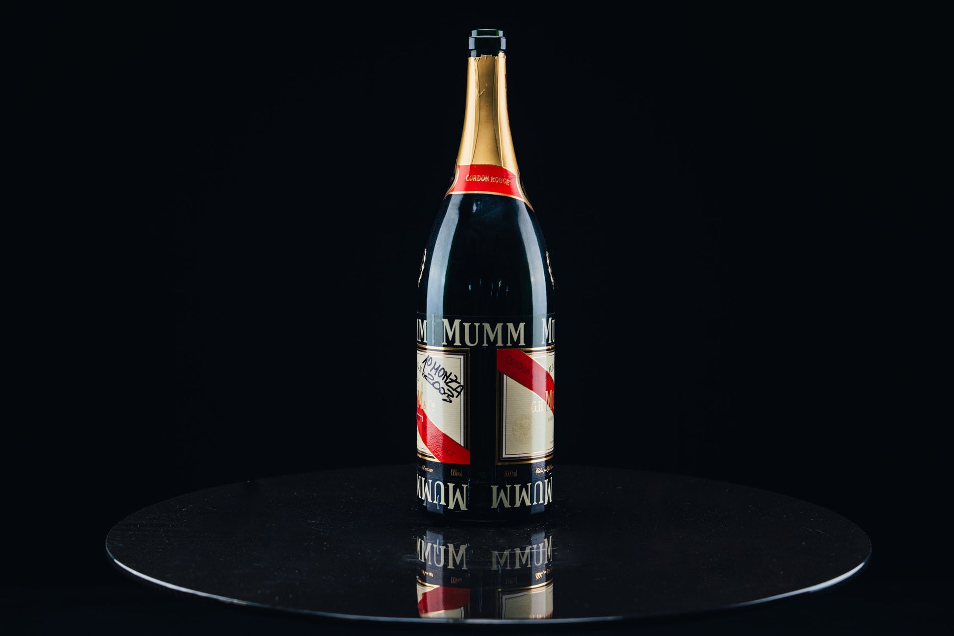 1052 - Mumm Podium Bottle Signed from Michael Schumacher