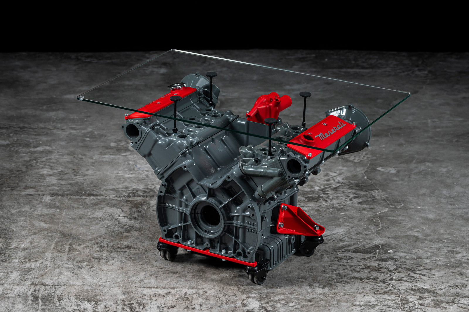 Maserati engine table with glass base