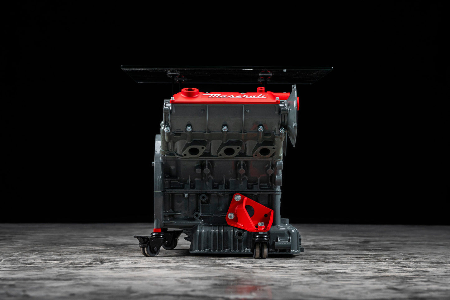 Maserati engine table with glass base