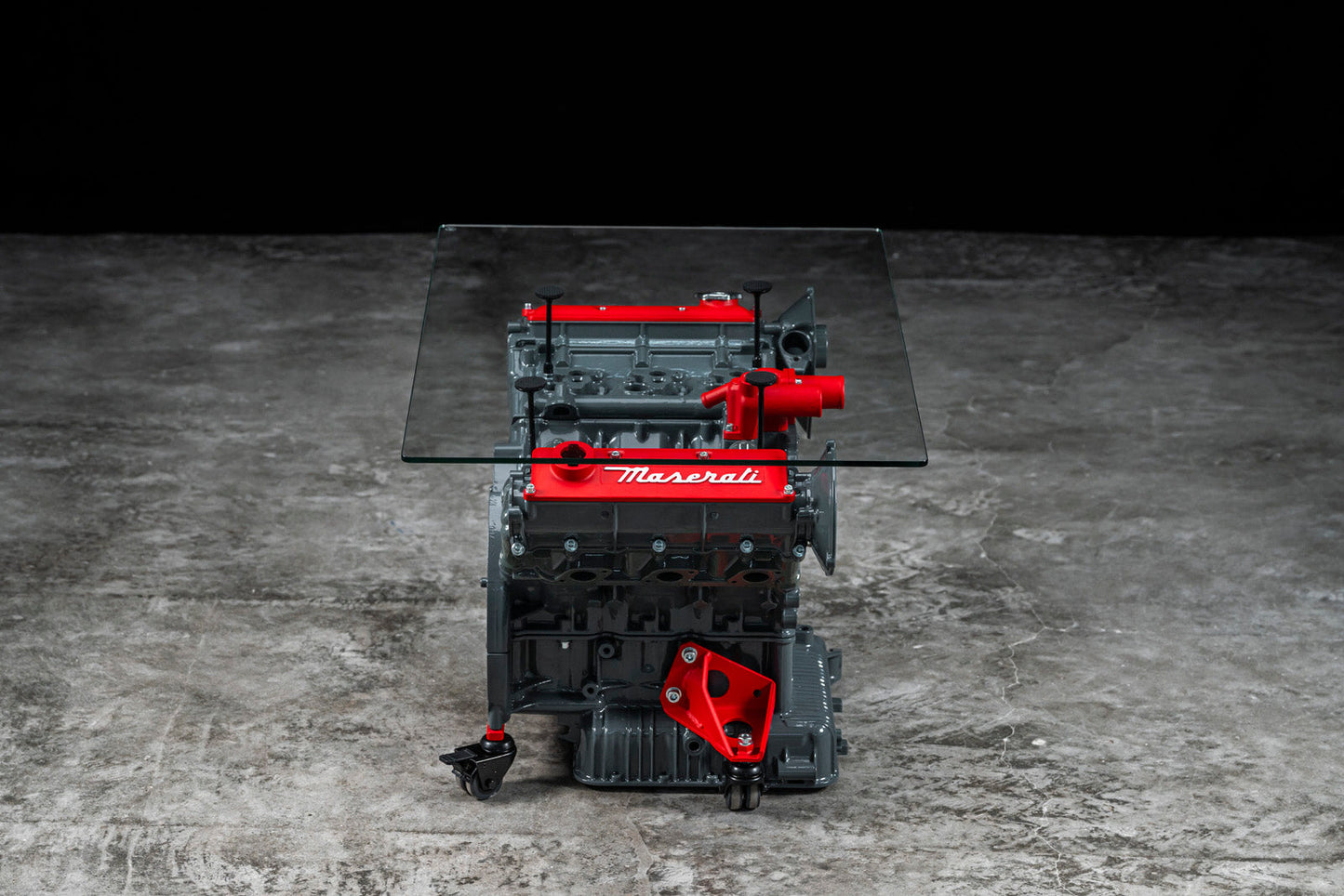 Maserati engine table with glass base