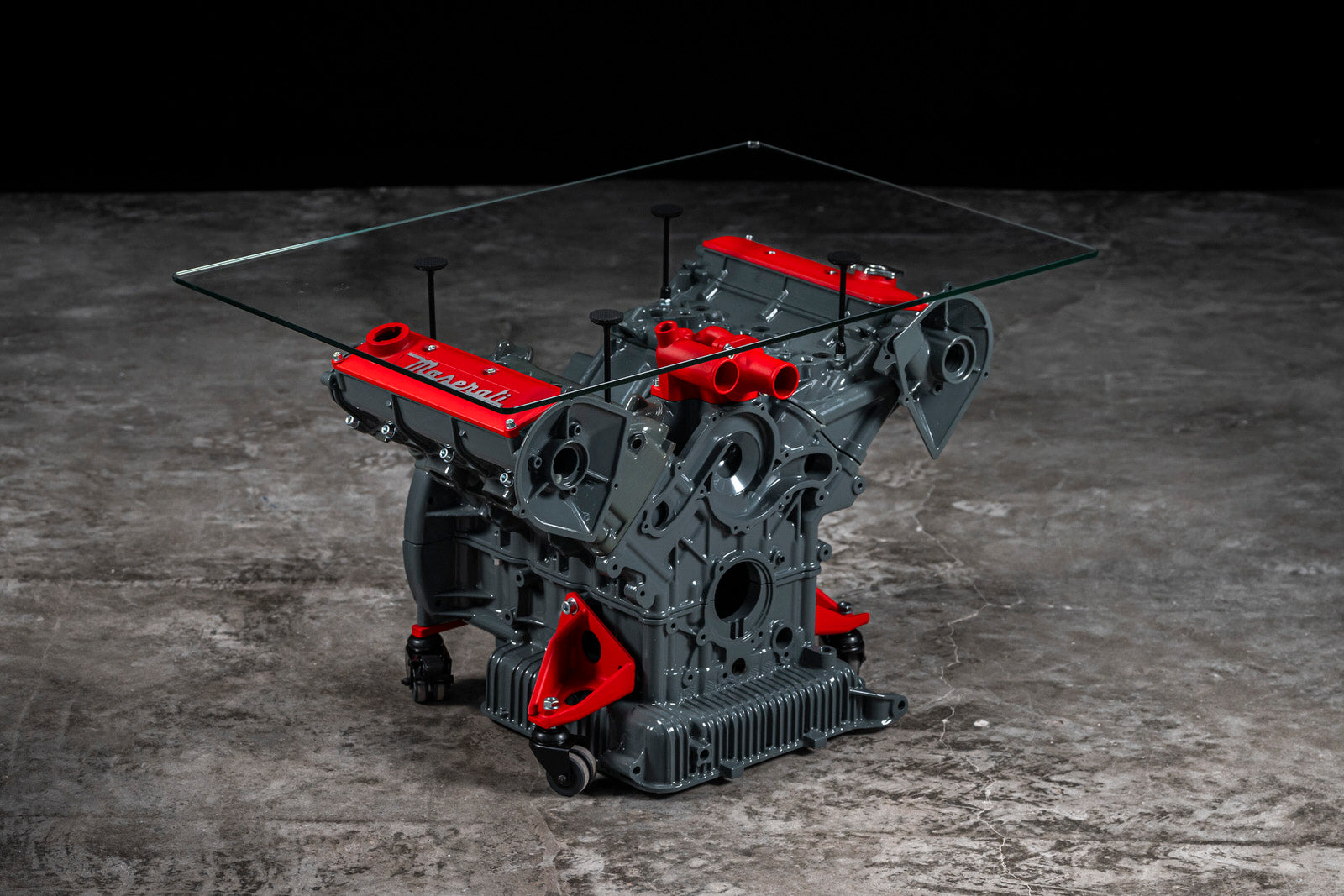 Maserati engine table with glass base