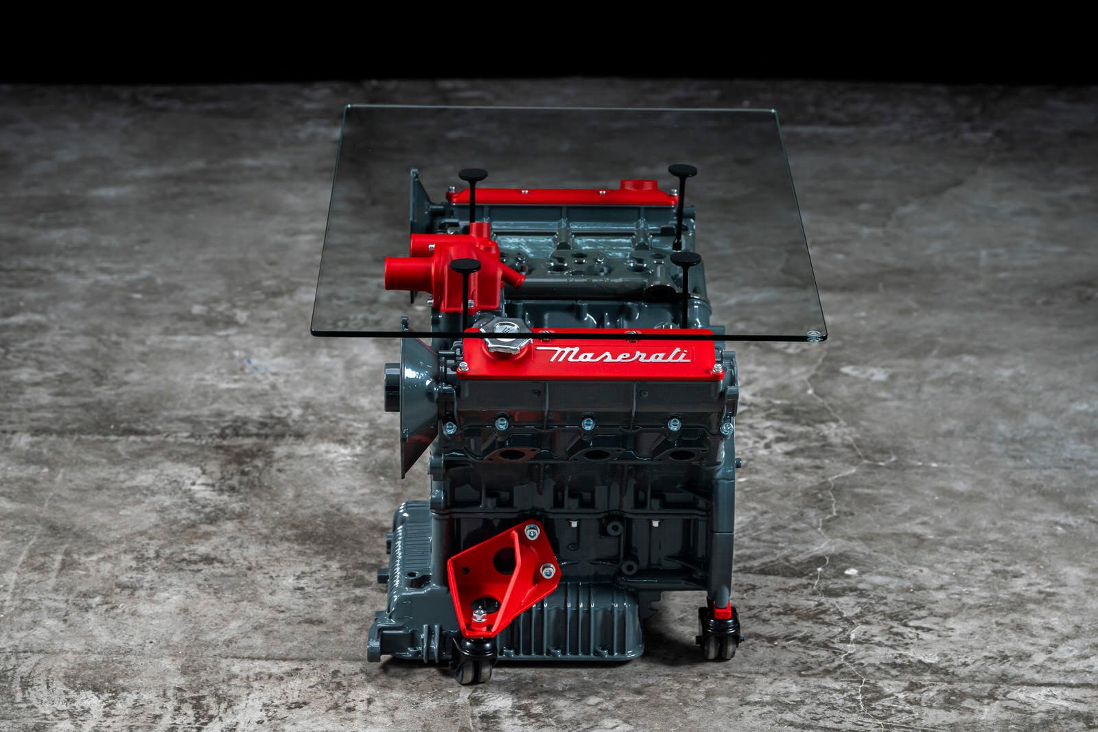 Maserati engine table with glass base